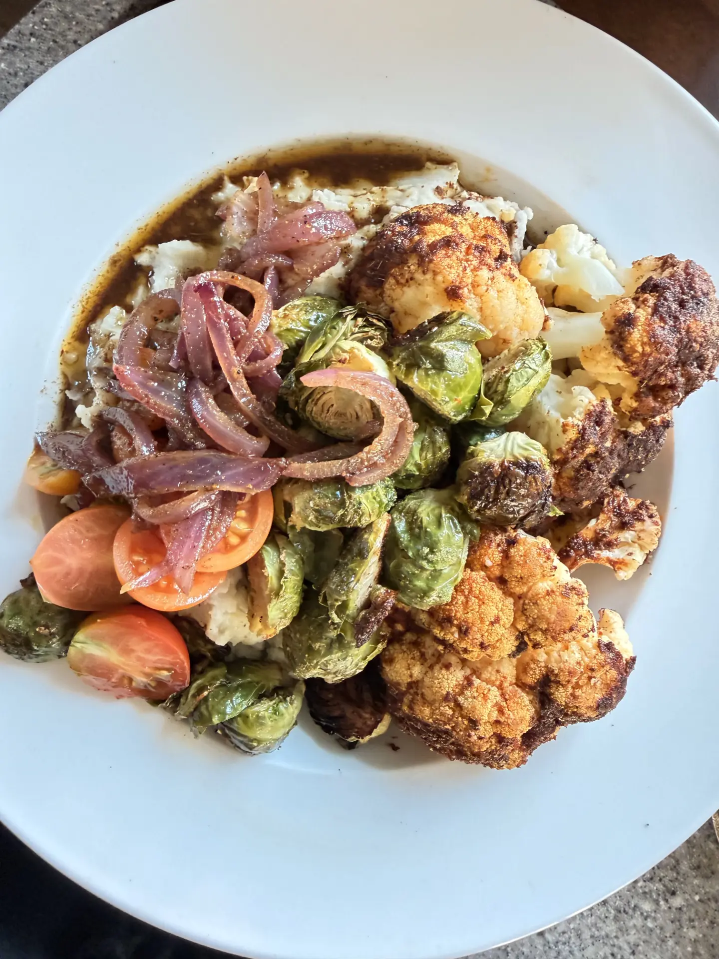 Blackened cauliflower with roasted brussels sprouts and caramelized onions